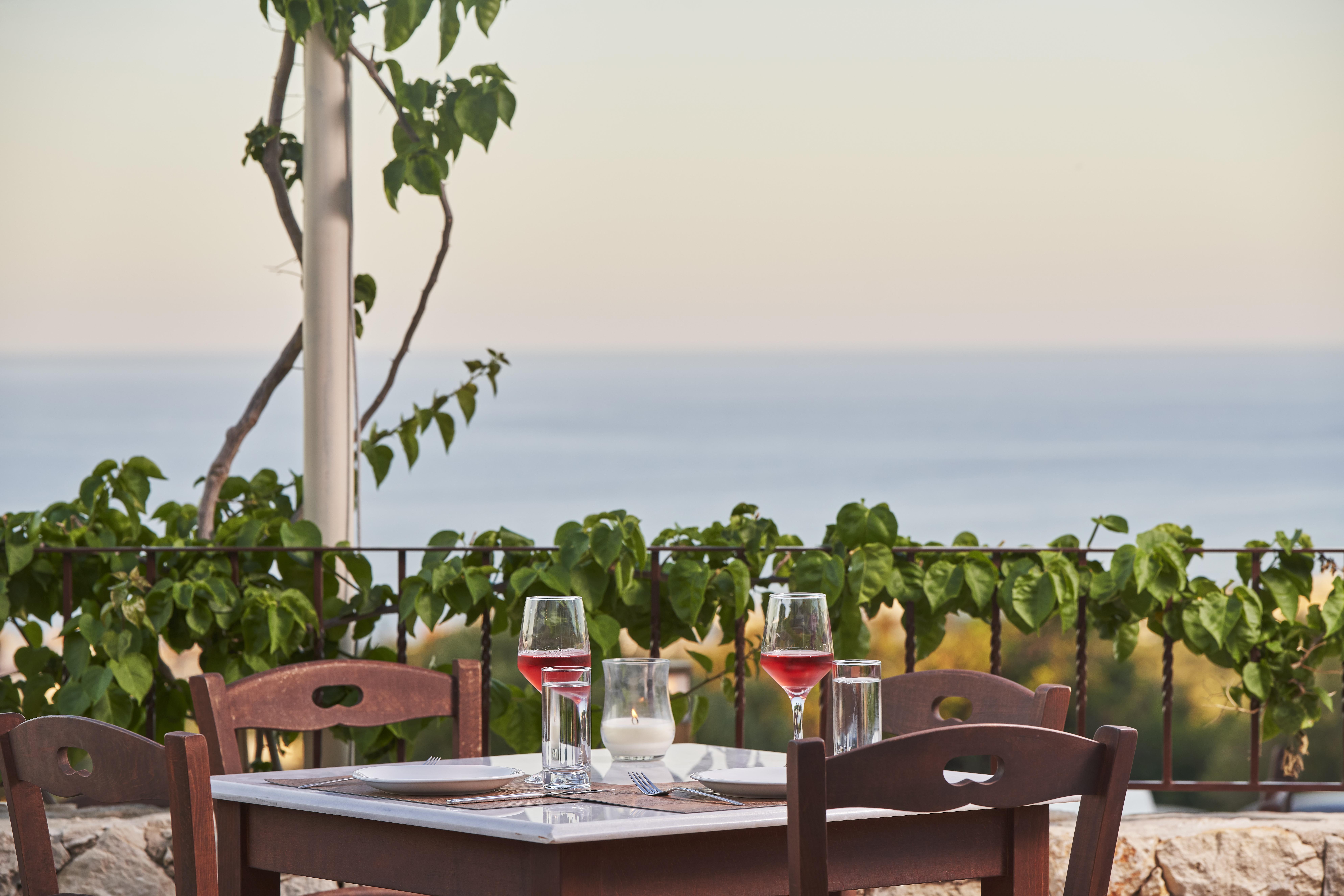 Esperides Resort Crete, The Authentic Experience Hersónissos Extérieur photo A glass of wine