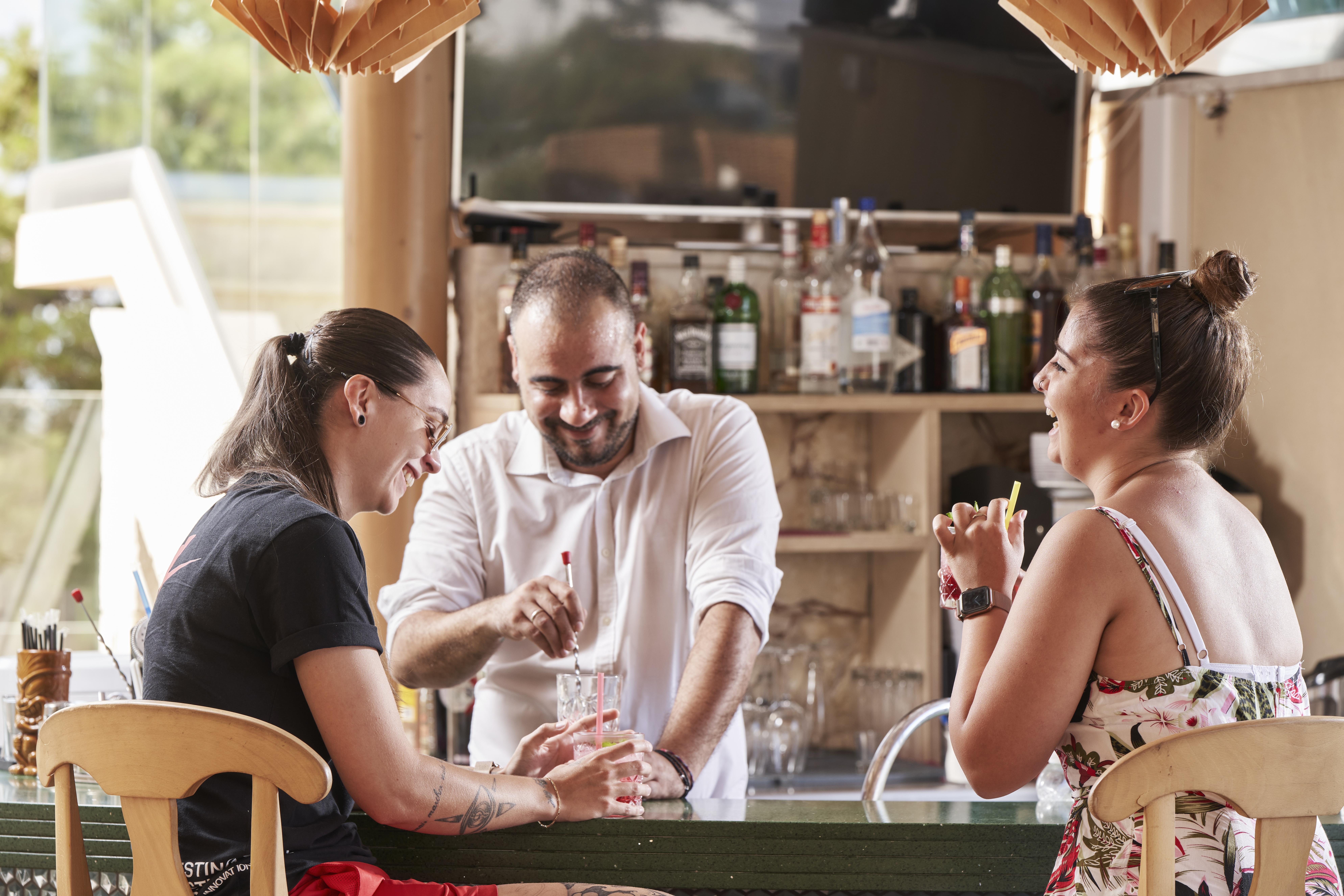 Esperides Resort Crete, The Authentic Experience Hersónissos Extérieur photo A bartender serving drinks