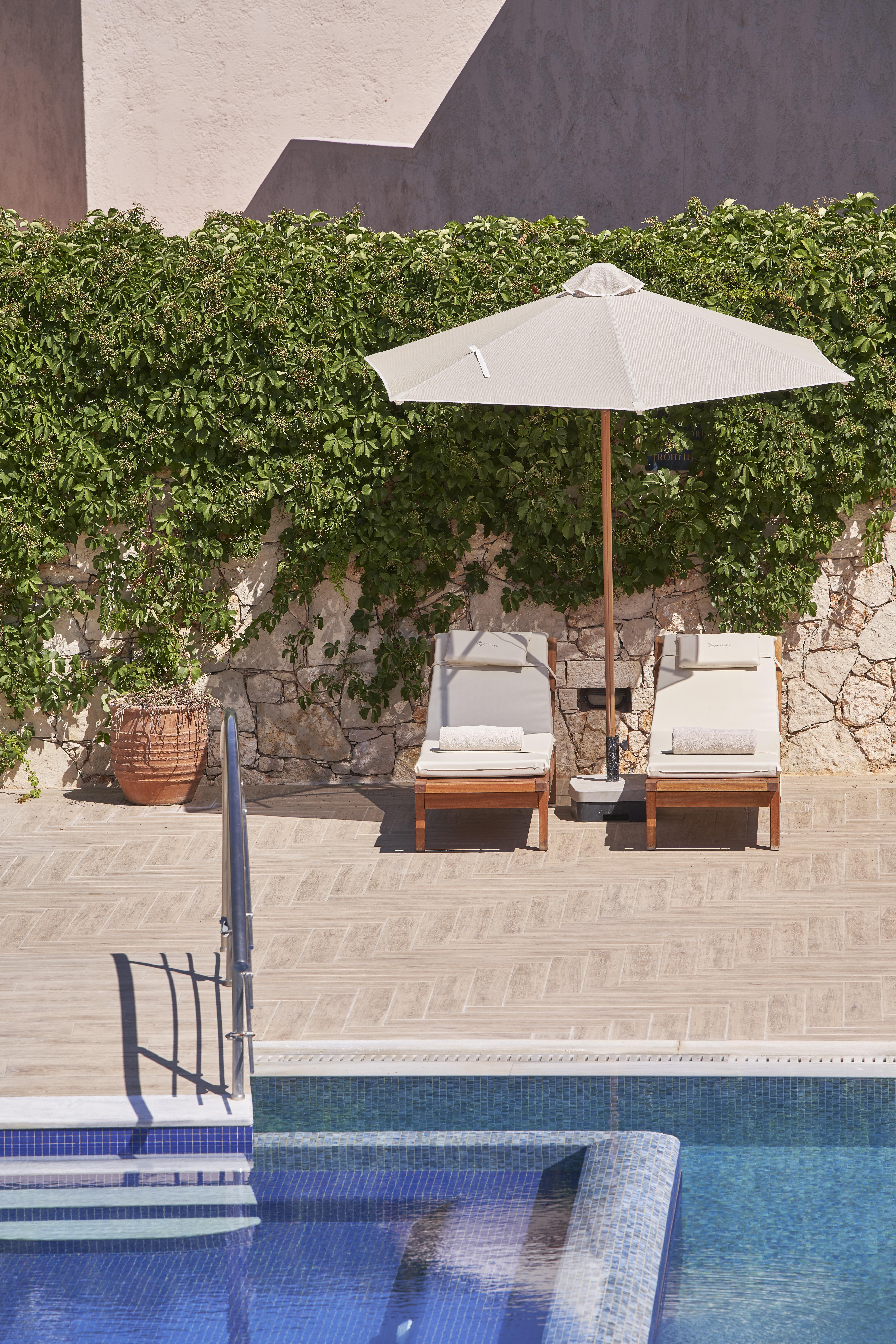 Esperides Resort Crete, The Authentic Experience Hersónissos Extérieur photo A pair of chaise longues